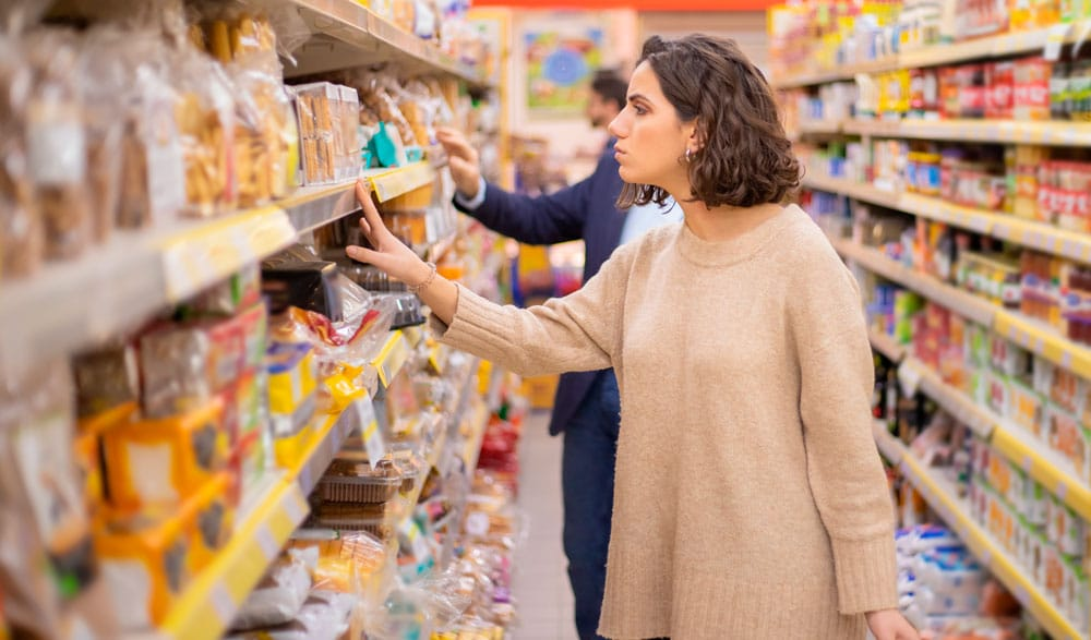 Woman looking for products on shelf
