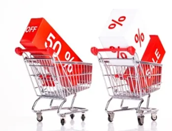 Retail shopping carts filled with blocks saying 50% and Sale