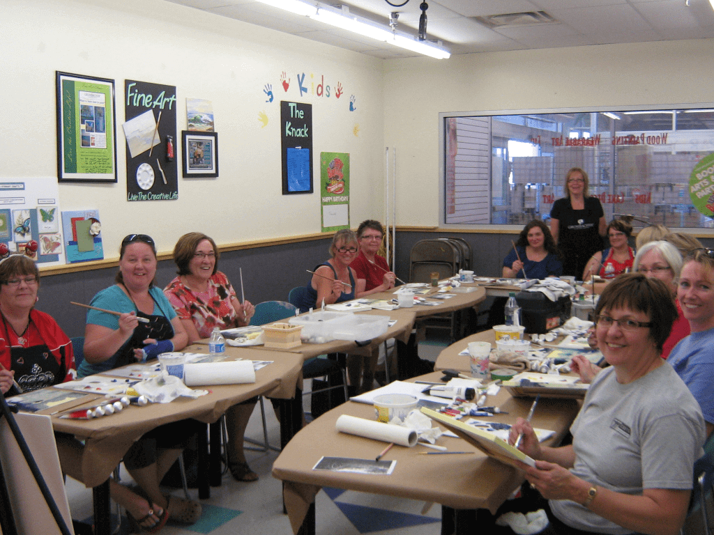 A group of ladies participating in an arts and crafts workshop